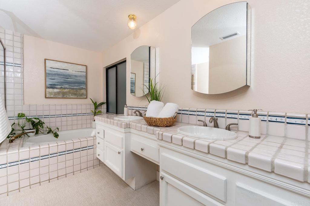 3913 Summer Way Escondido, CA 92025 - Photo 7 of 40 a bathroom with a sink and a mirror