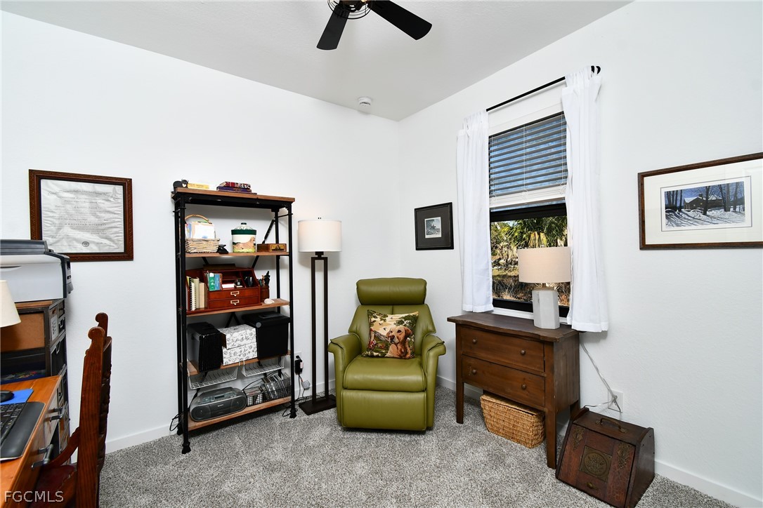 809 Bell Boulevard Lehigh Acres, FL 33974 - Photo 24 of 37 a bedroom with furniture and a window