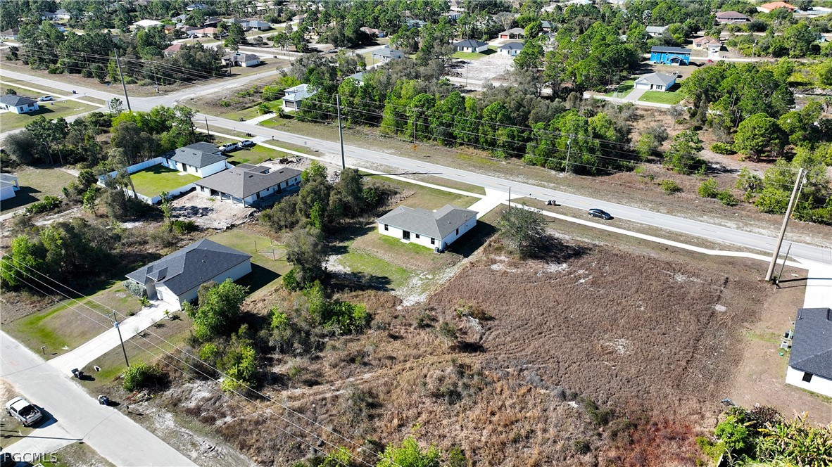 809 Bell Boulevard Lehigh Acres, FL 33974 - Photo 32 of 37 a view of a street with houses