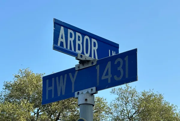 a view of a wooden house with a fence