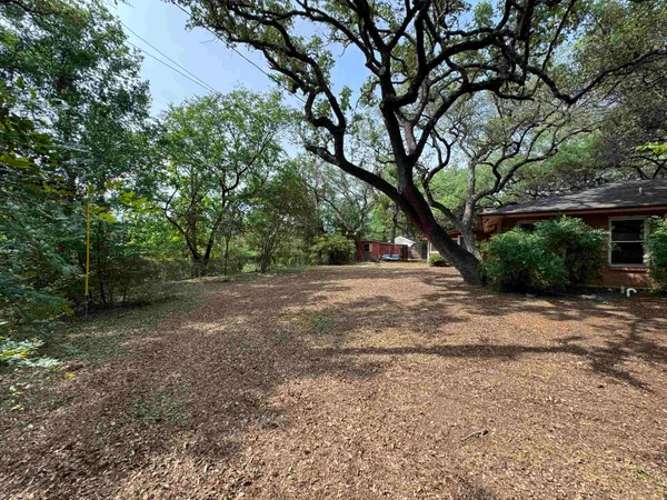 a view of backyard with green space