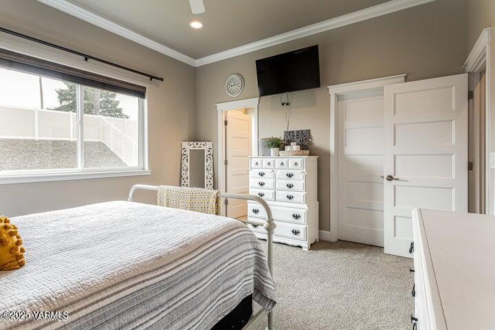 7310 Whitman Avenue Yakima, WA 98903 - Photo 18 of 31 a bedroom with a bed dresser and a large window