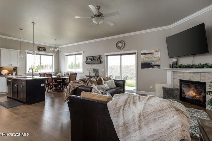 7310 Whitman Avenue Yakima, WA 98903 - Photo 9 of 31 a living room with furniture fireplace and flat screen tv