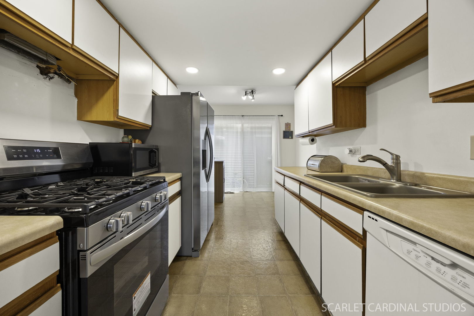 4S768 Pinehurst Drive Naperville, IL 60563 - Photo 6 of 15 a kitchen with stainless steel appliances granite countertop a sink and a stove