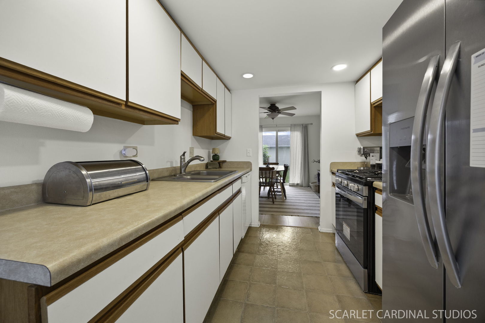 4S768 Pinehurst Drive Naperville, IL 60563 - Photo 7 of 15 a kitchen with stainless steel appliances granite countertop a refrigerator a stove and a sink