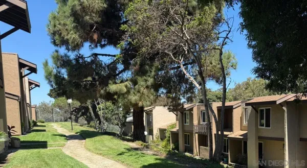 a backyard of a house with lots of green space