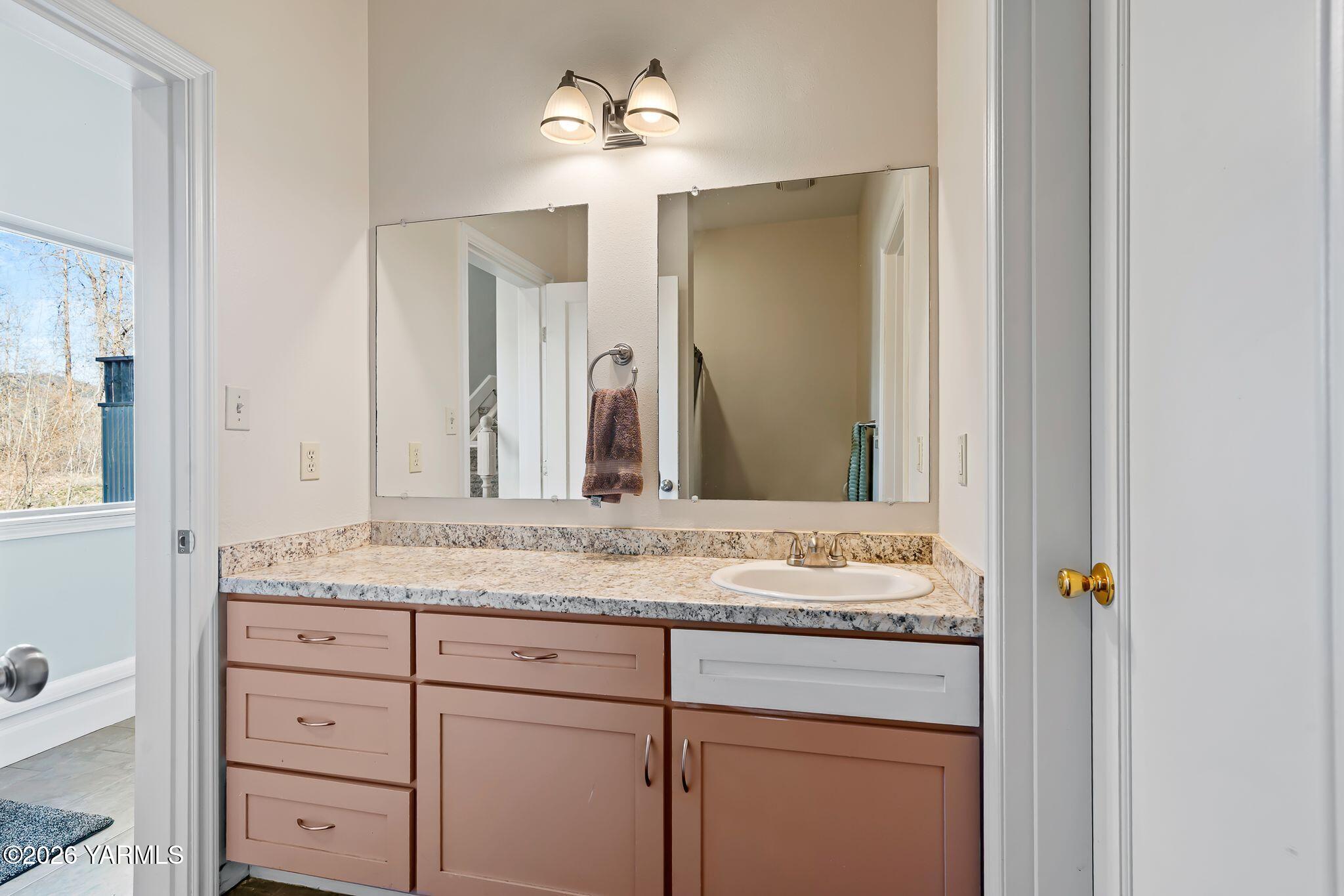 1575 Nile Road Naches, WA 98937 - Photo 26 of 51 a bathroom with a granite countertop sink and a mirror