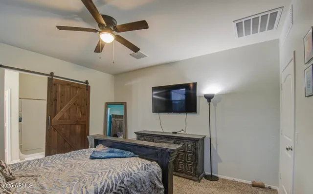 a bathroom with a shower and a sink