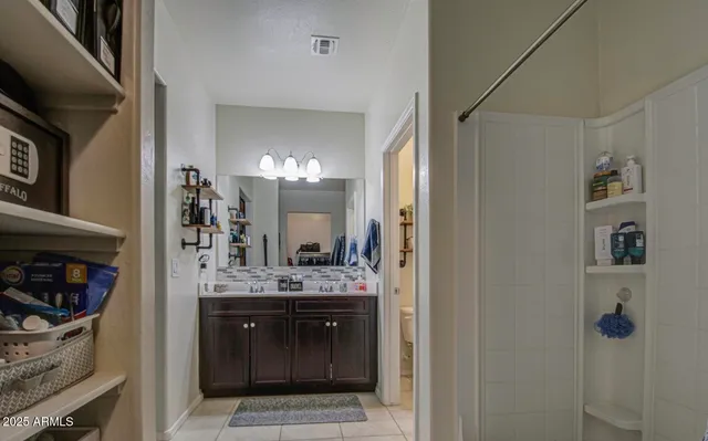 a bedroom with a bed and a table