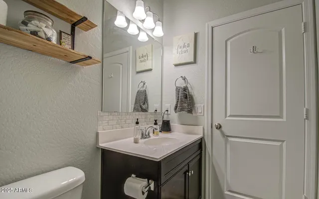 a workspace with wooden floor and windows