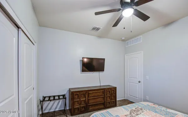 a view of a patio with a table and chairs
