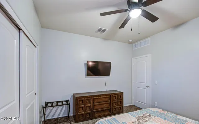 a view of a patio with a table and chairs