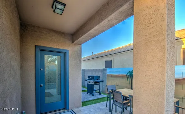 a view of a house with swimming pool and sitting area