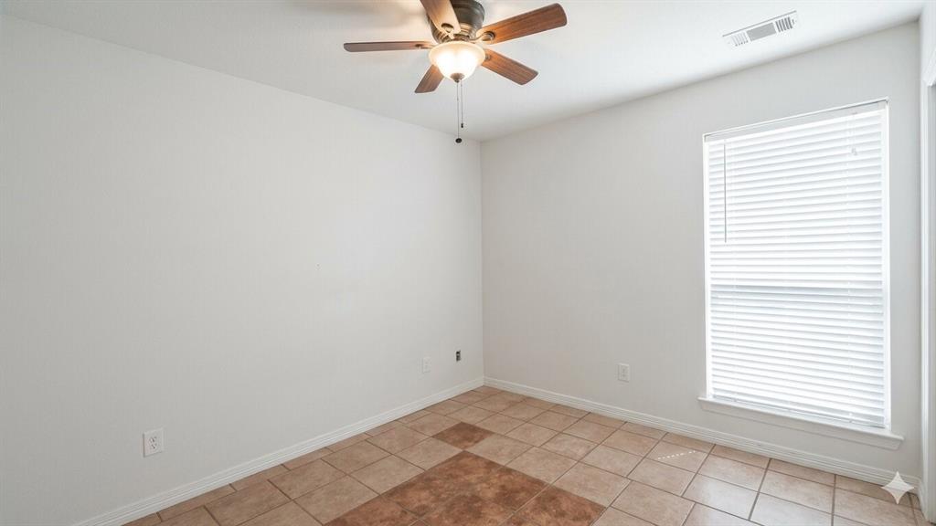 211 Vista Ridge Drive Venus, TX 76084 - Photo 18 of 24 Room featuring tiled flooring, a window with blinds, a ceiling fan with integrated lighting, and white baseboards