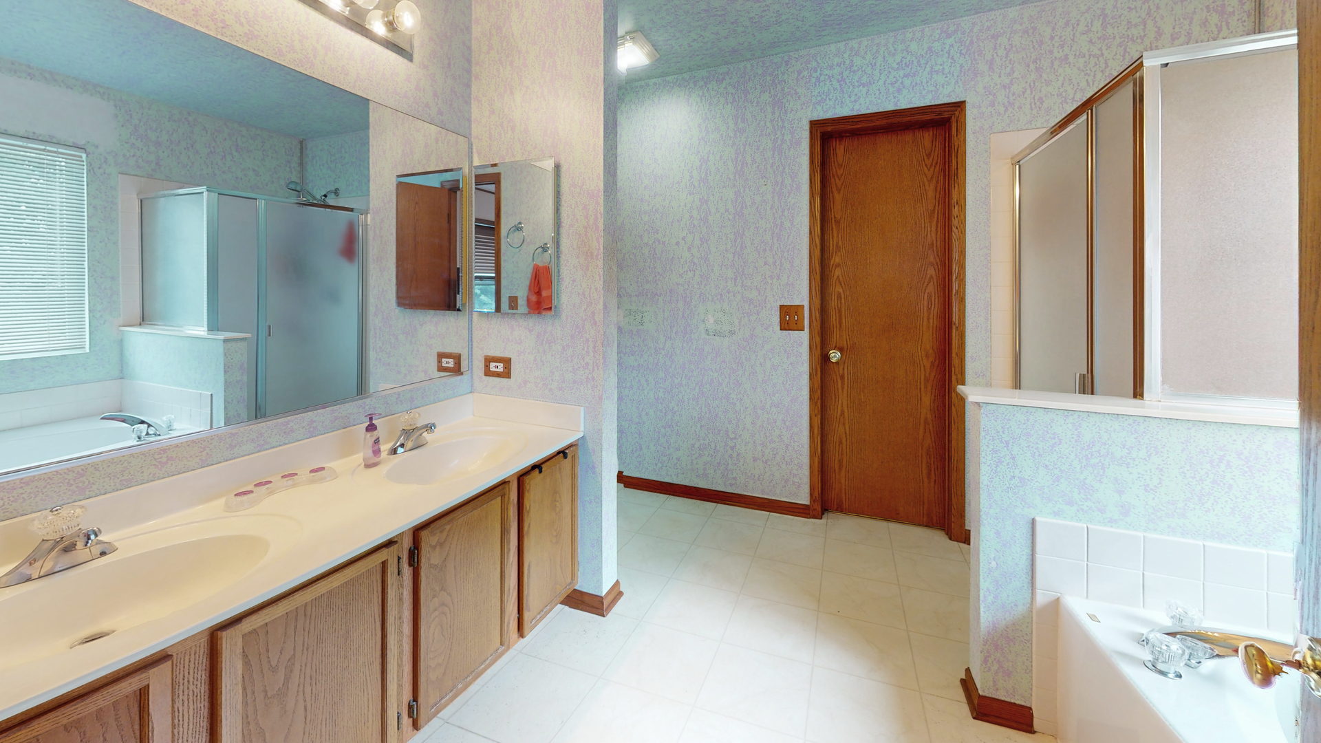 2048 Norwich Drive Bartlett, IL 60103 - Photo 13 of 25 a bathroom with a double vanity sink mirror and shower