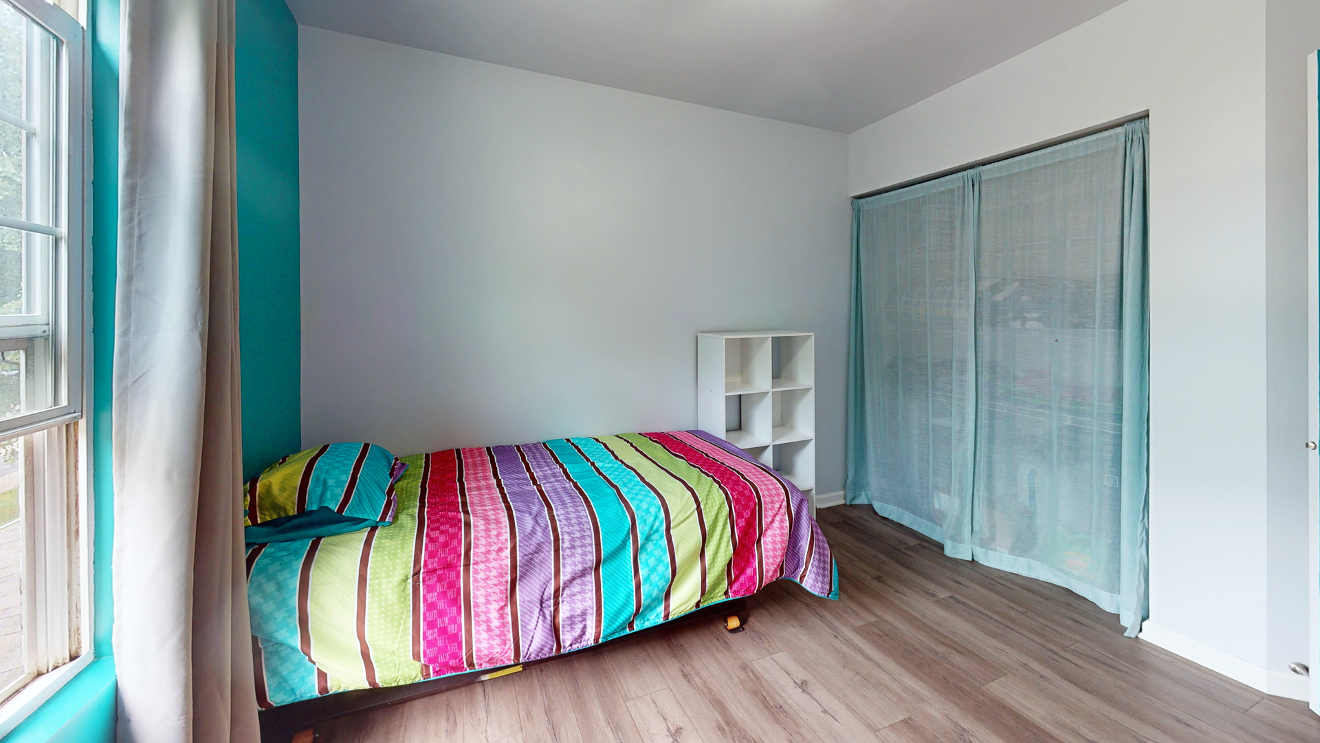 2048 Norwich Drive Bartlett, IL 60103 - Photo 17 of 25 a bed sitting in a bedroom next to a window