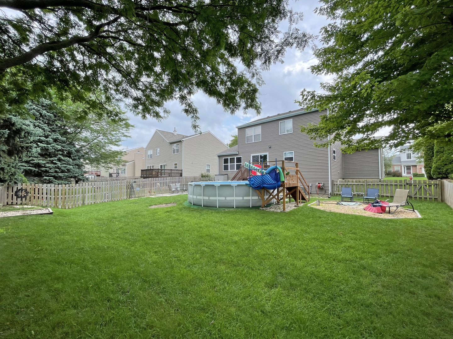 2048 Norwich Drive Bartlett, IL 60103 - Photo 20 of 25 a view of a house with backyard porch and garden