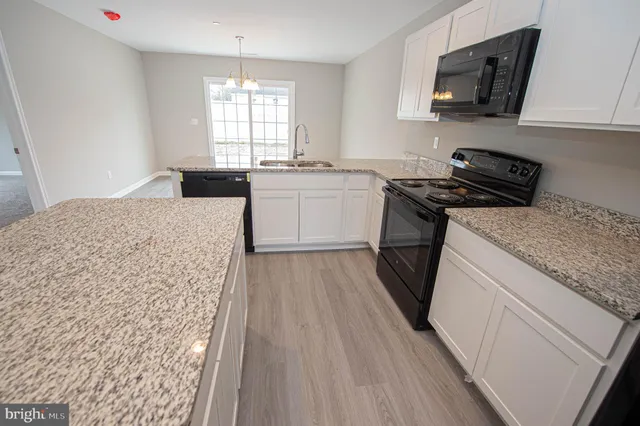 wooden floor in an empty room with a mirror