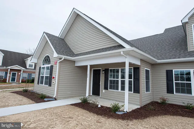 a view of empty room with a large window