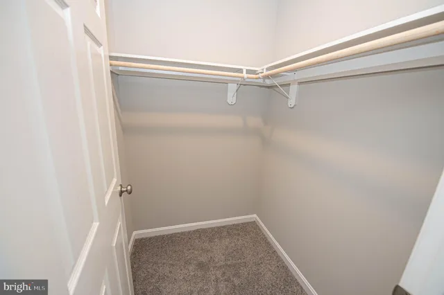 a bathroom with a sink toilet and window