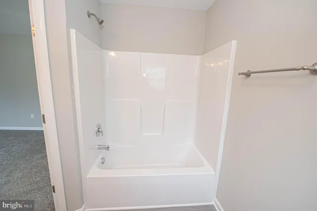 an empty room with wooden door