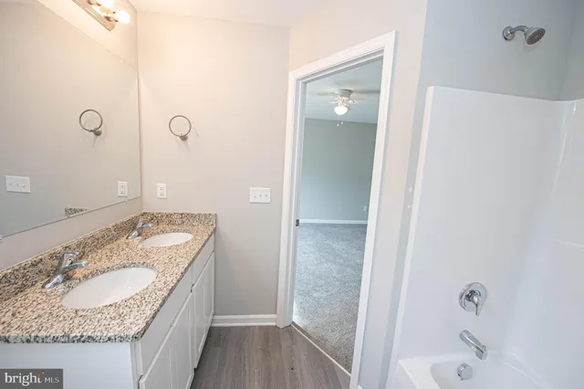 an empty room with a empty space and windows