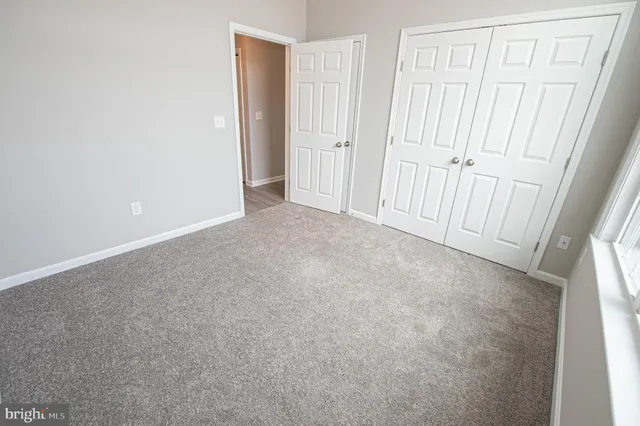 a bathroom with a bathtub and a toilet
