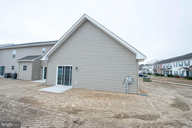 a view of backyard with large windows