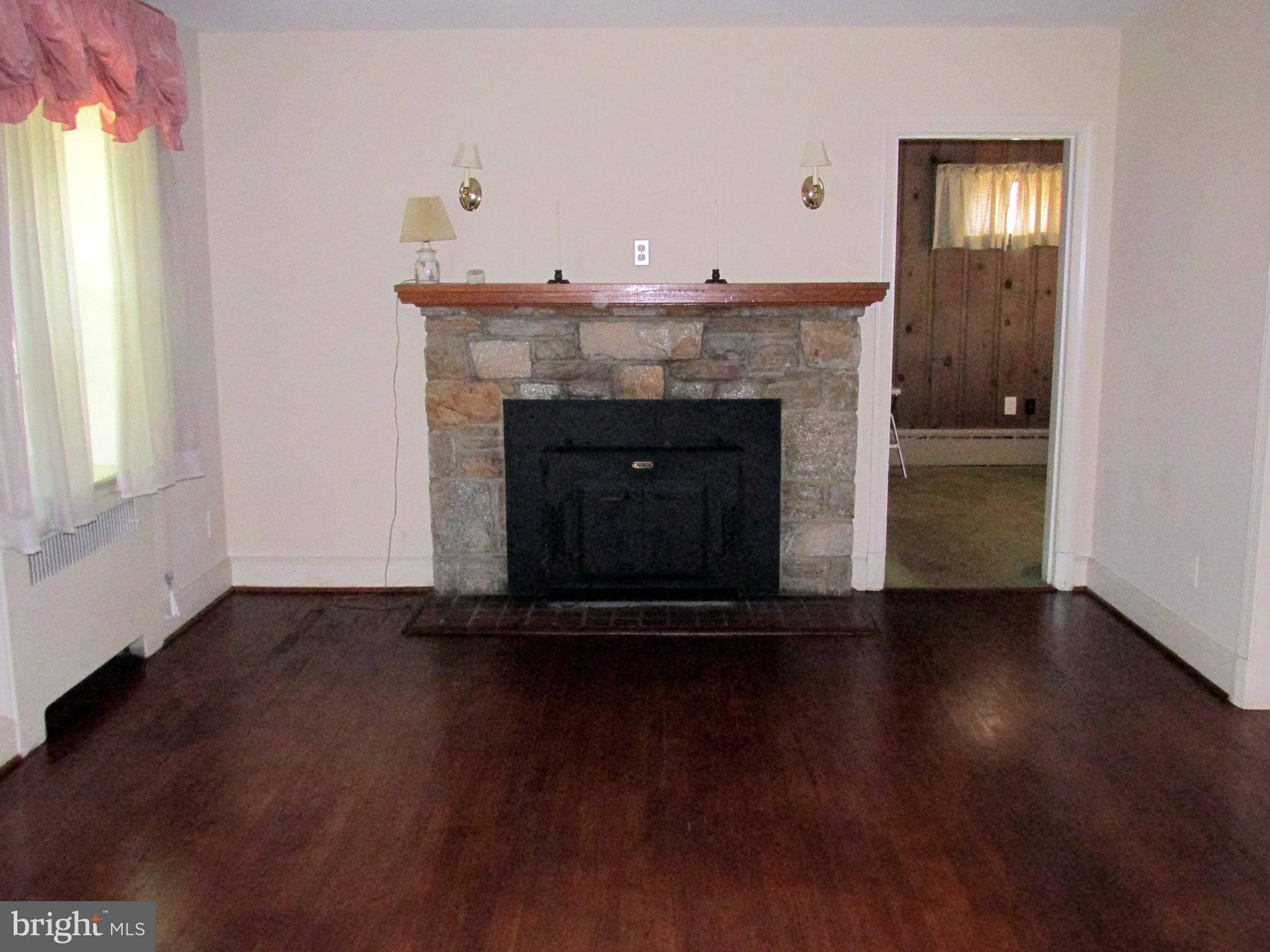 3006 Dunmore Road Baltimore, MD 21222 - Photo 2 of 42 Large Living room with fireplace