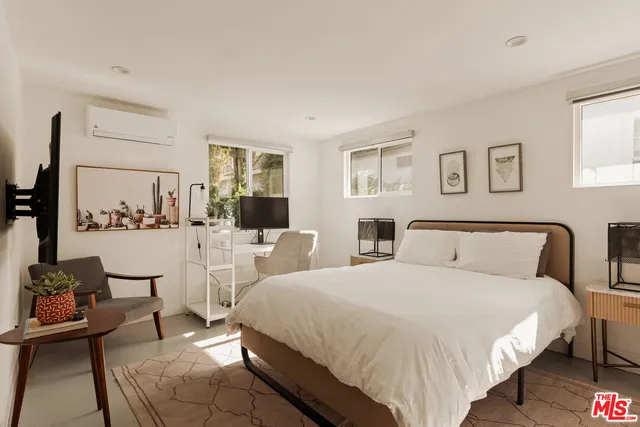 a bed room with a bed and a couch