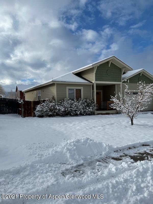1123 East 19th Street Rifle, CO 81650 - Photo 1 of 37 a front view of a house with garden