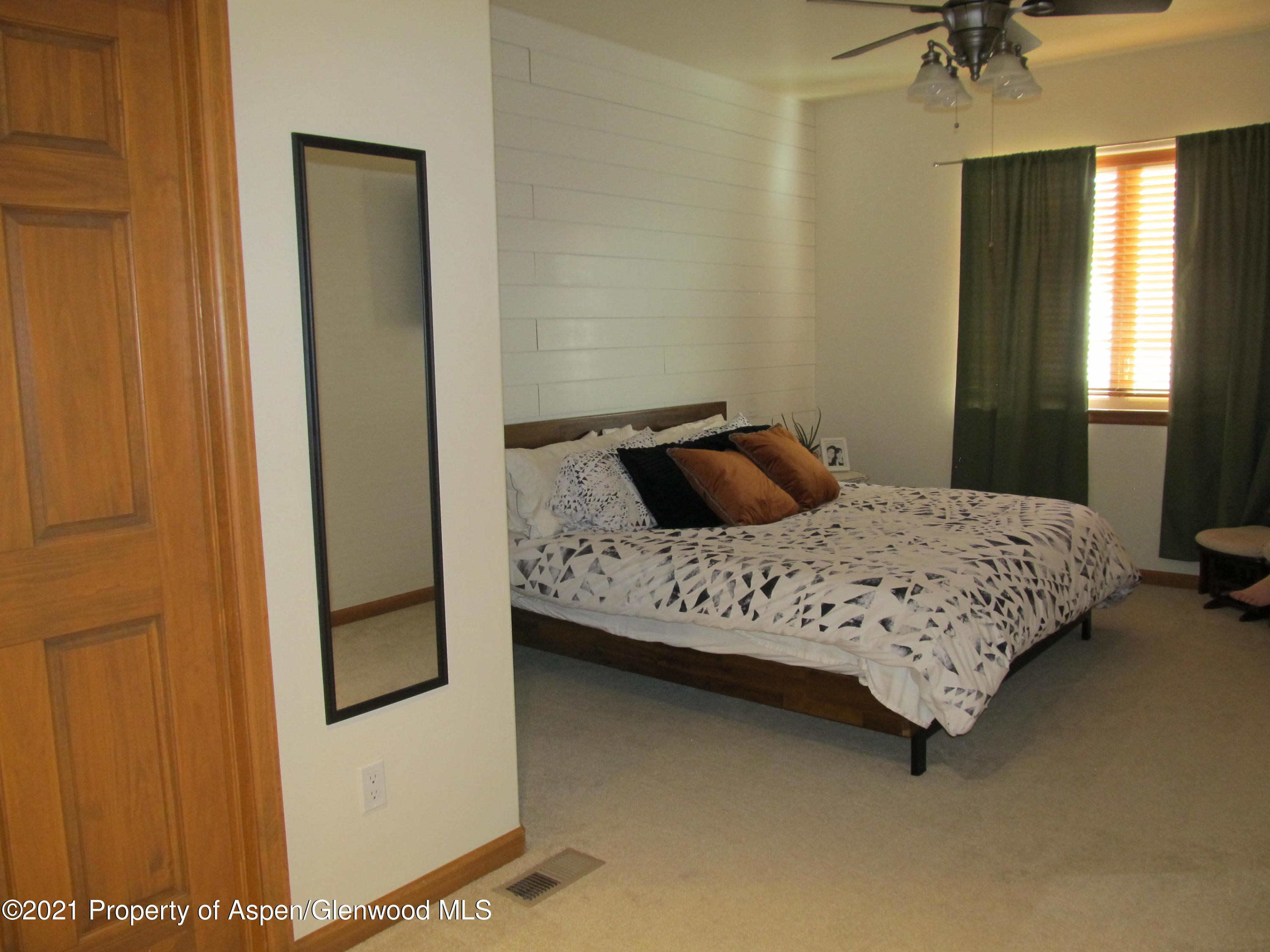 1123 East 19th Street Rifle, CO 81650 - Photo 19 of 37 a bedroom with a bed and a window