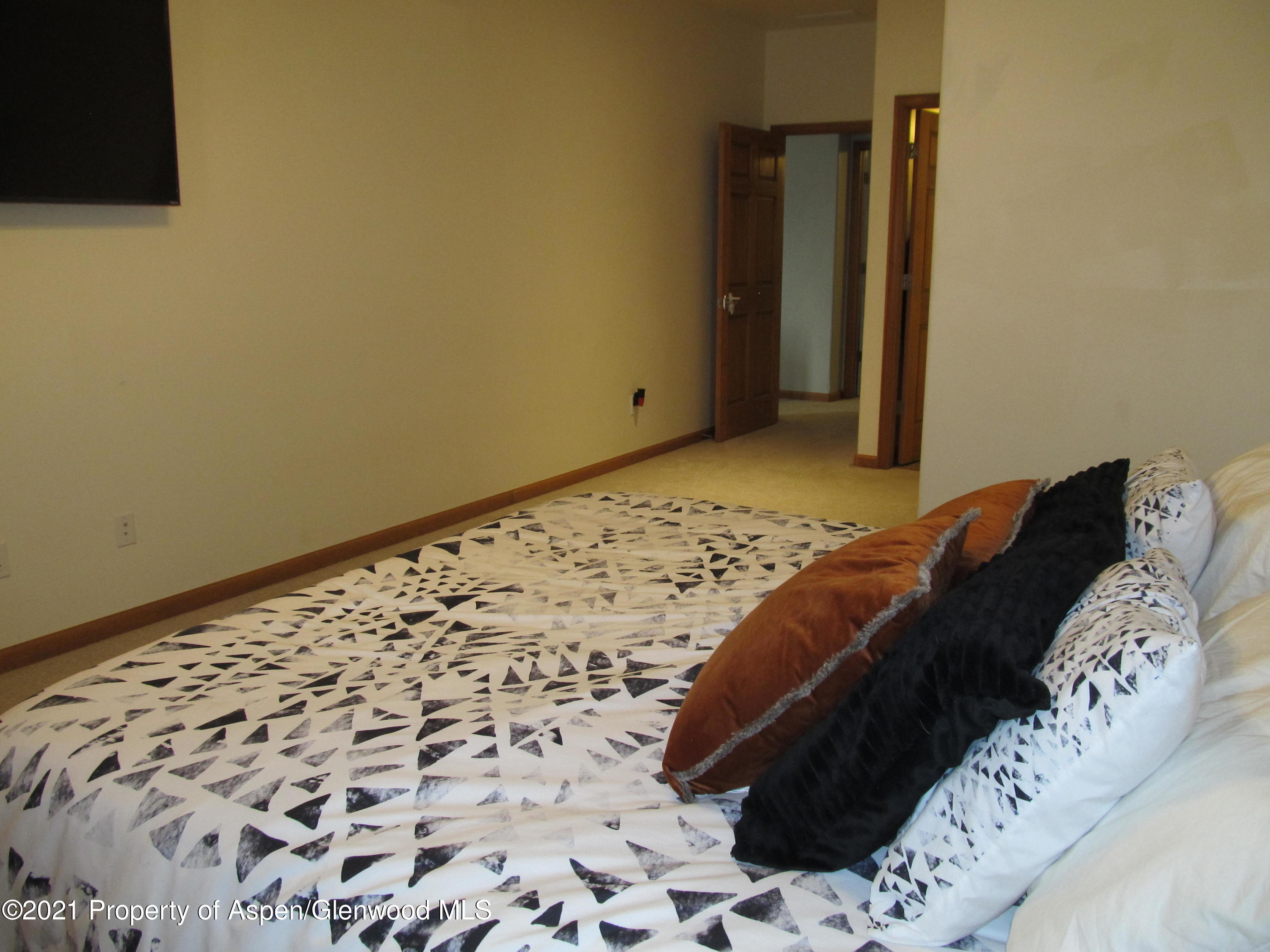 1123 East 19th Street Rifle, CO 81650 - Photo 20 of 37 a bedroom with a bed