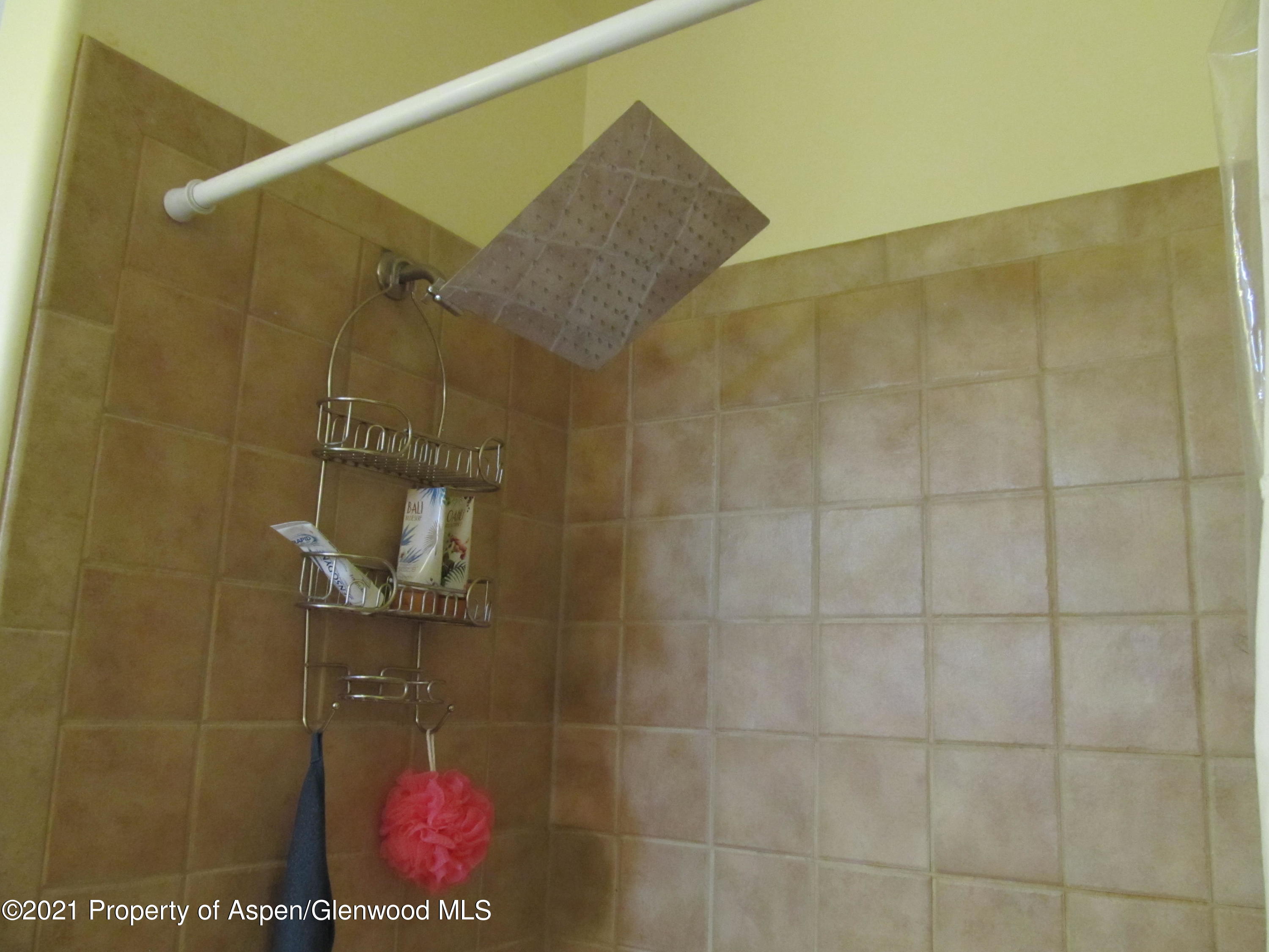 1123 East 19th Street Rifle, CO 81650 - Photo 23 of 37 a bathroom with a shower