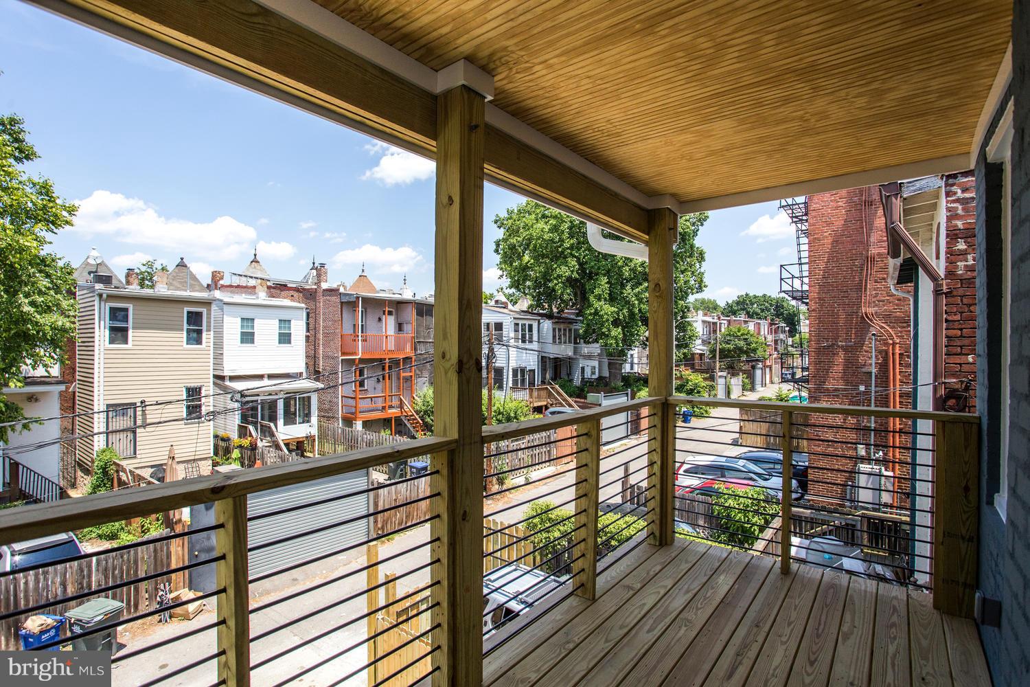59 Randolph Place Northwest, Unit PH Washington, DC 20001 - Photo 15 of 27 a view of a balcony with wooden floor