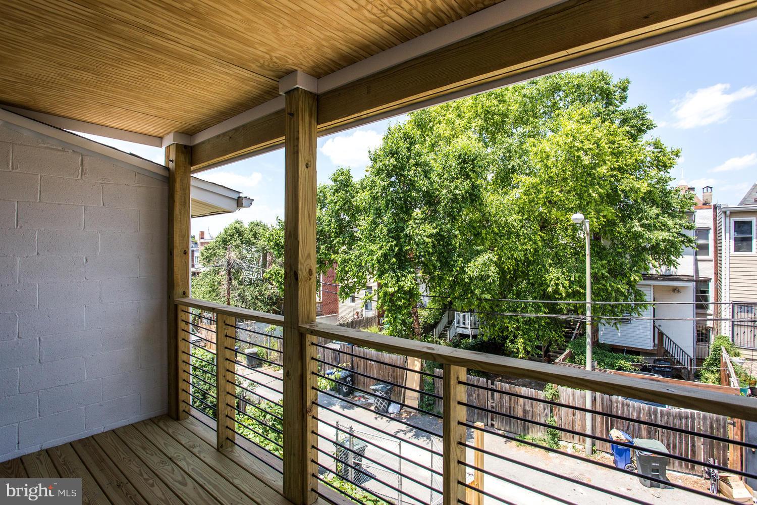 59 Randolph Place Northwest, Unit PH Washington, DC 20001 - Photo 16 of 27 a view of a balcony with wooden floor