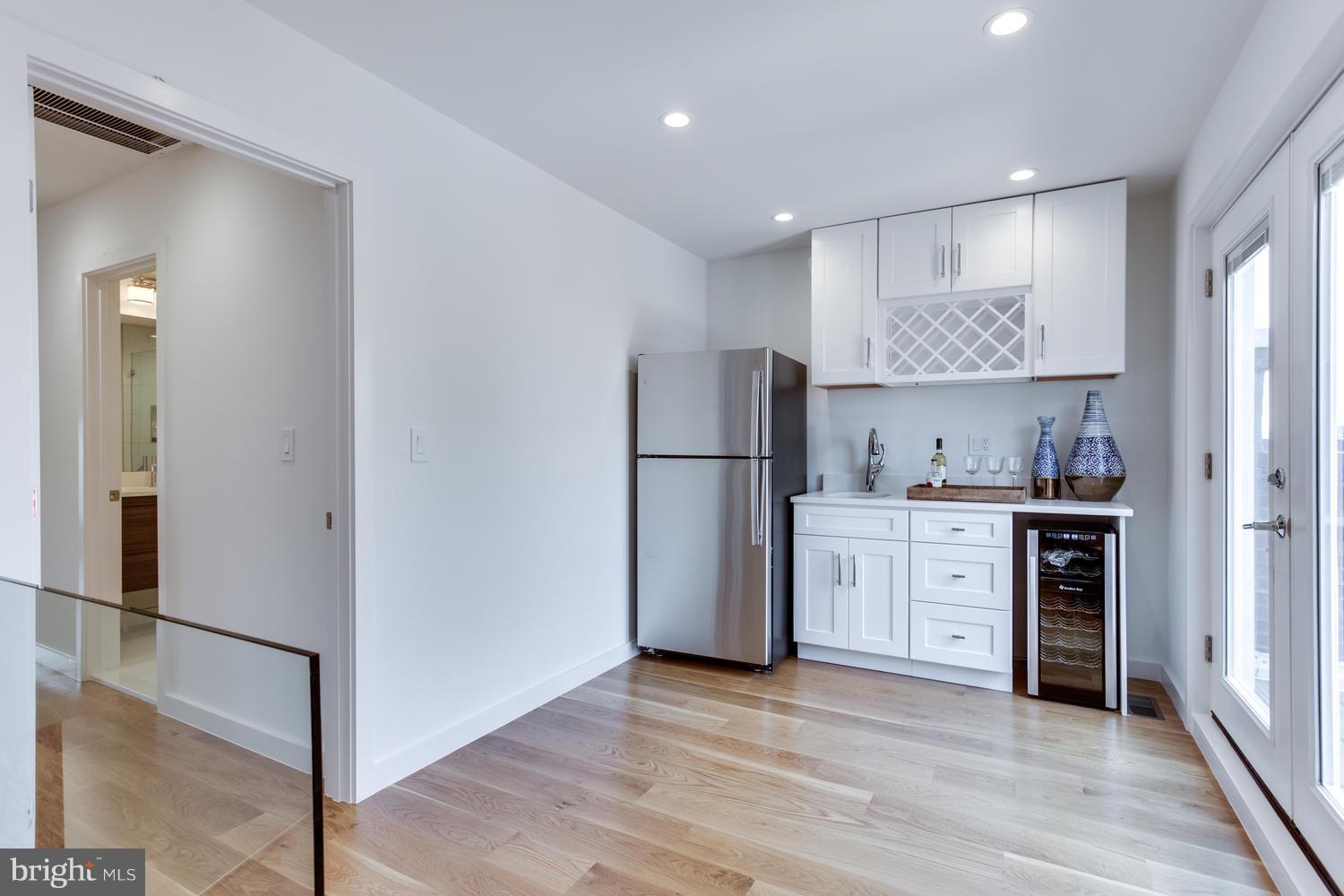 59 Randolph Place Northwest, Unit PH Washington, DC 20001 - Photo 17 of 27 a kitchen with a refrigerator a sink and dishwasher