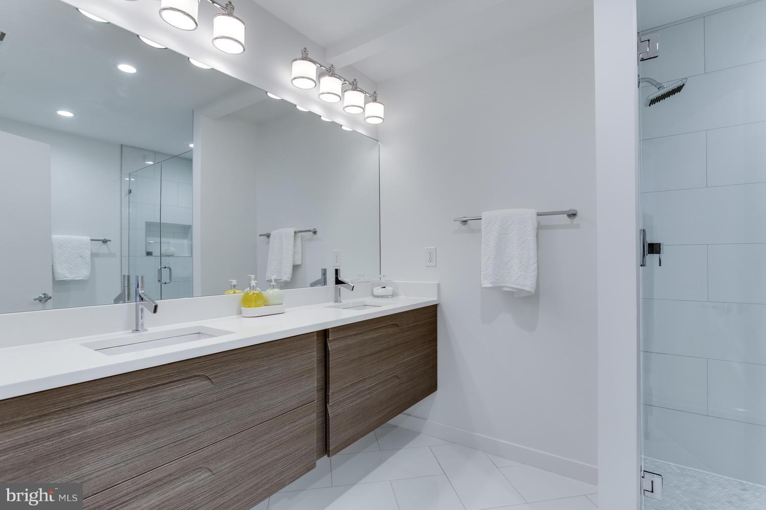 59 Randolph Place Northwest, Unit PH Washington, DC 20001 - Photo 21 of 27 a view with double vanity sink and a mirror