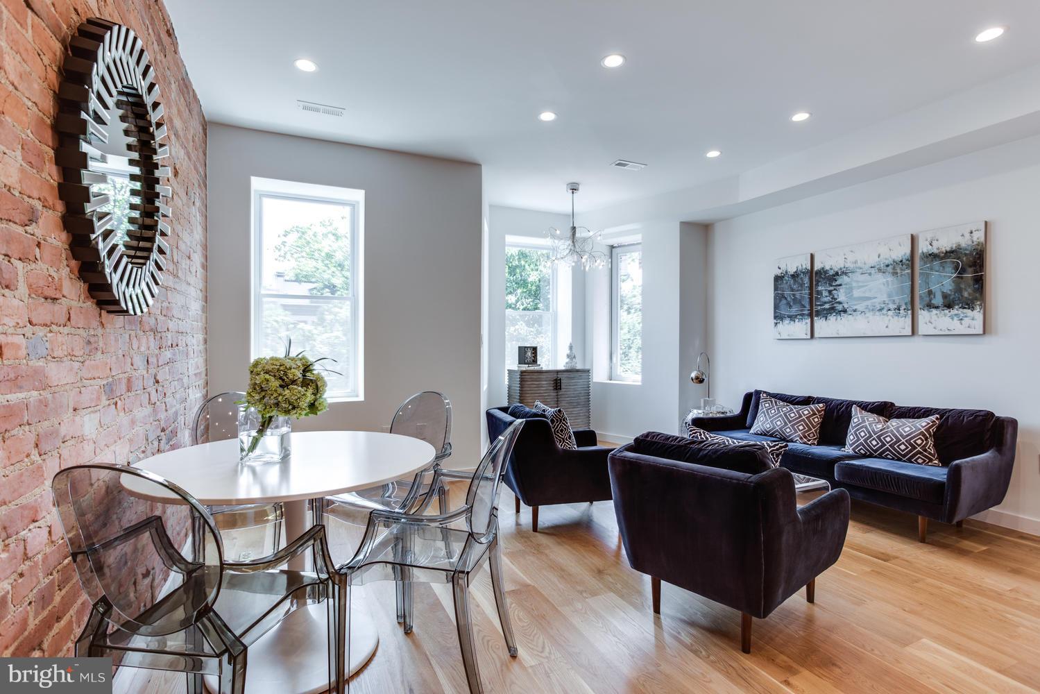 59 Randolph Place Northwest, Unit PH Washington, DC 20001 - Photo 8 of 27 a living room with furniture and wooden floor