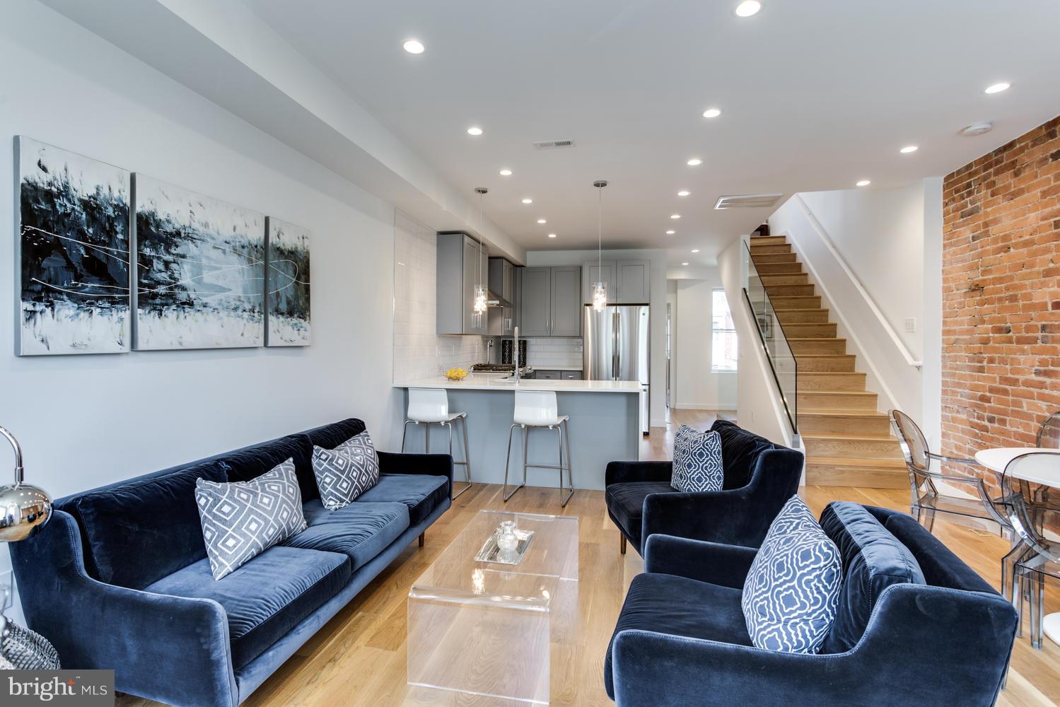 59 Randolph Place Northwest, Unit PH Washington, DC 20001 - Photo 10 of 27 a living room with furniture and a wooden floor