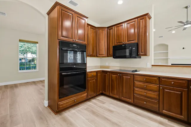 a kitchen with a sink stove and refrigerator