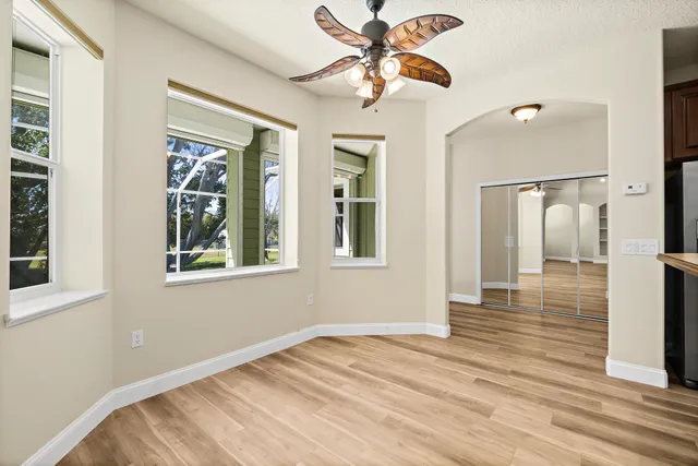 a view of a kitchen cabinets and a wooden floor