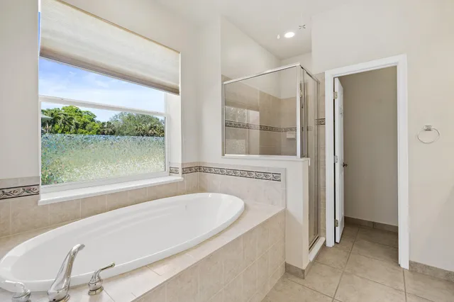 a bathroom with a bathtub and a shower