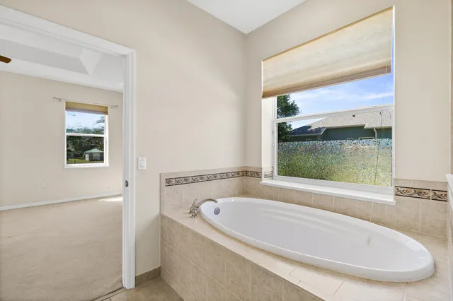 a bathroom with a sink double vanity and a mirror