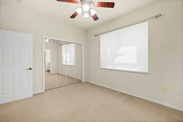 a bathroom with a toilet sink and a mirror