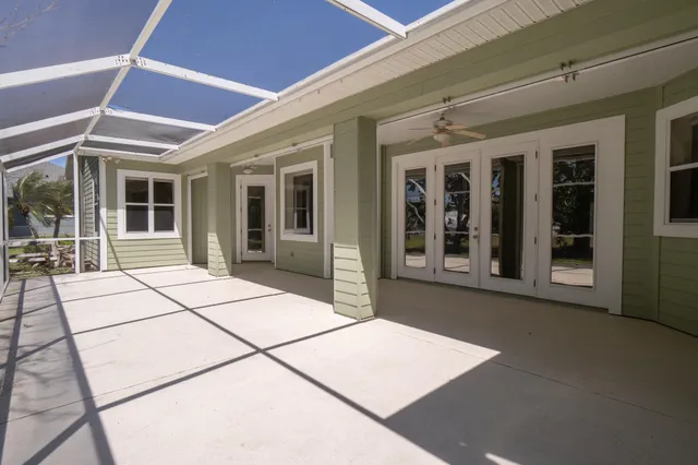a backyard of a house with lots of green space and fountain