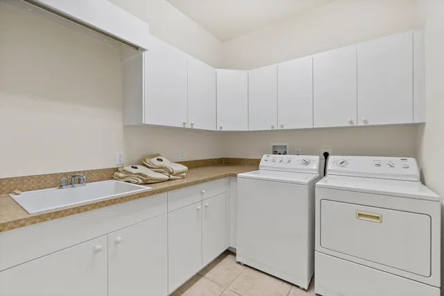 an aerial view of a houses with a yard