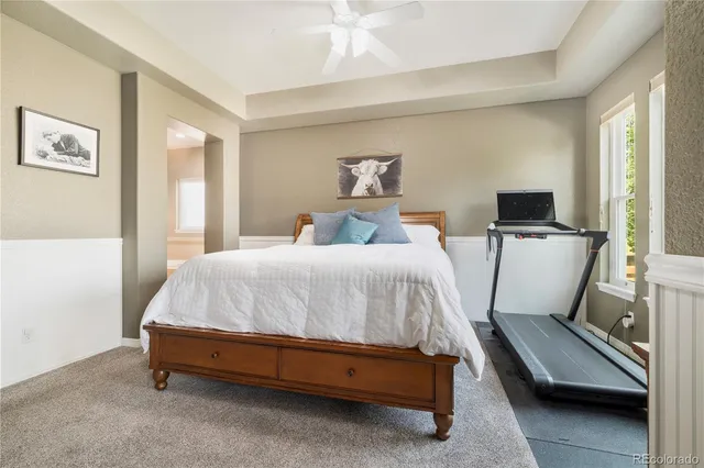 a bedroom with a bed and a couch