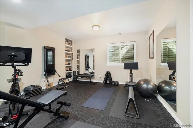 a room with furniture and gym equipment