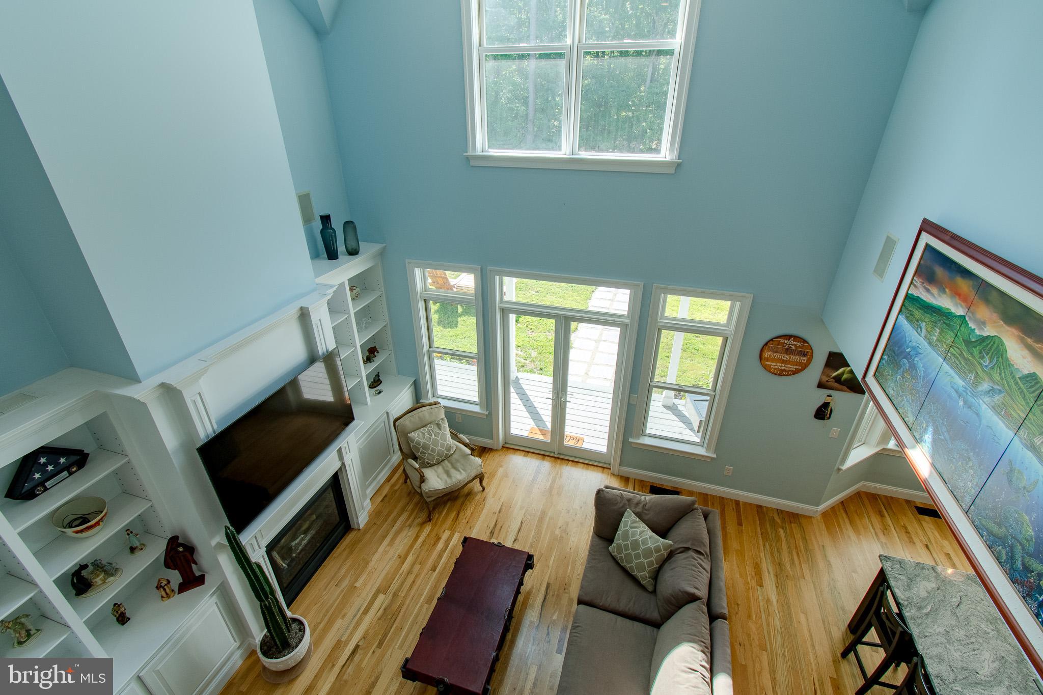 7841 Pea Neck Road St. Michaels, MD 21663 - Photo 25 of 41 a living room with furniture and a flat screen tv
